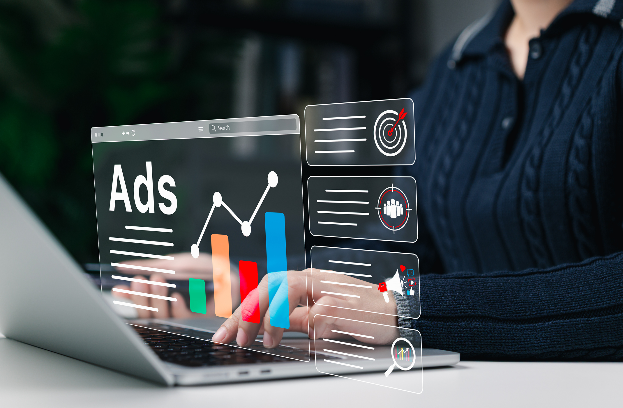 Digital Marketing and Online Advertising Strategy Concept. A person using laptop with advertising icons, performance metrics, audience targeting, and campaign strategy analytics for online marketing.